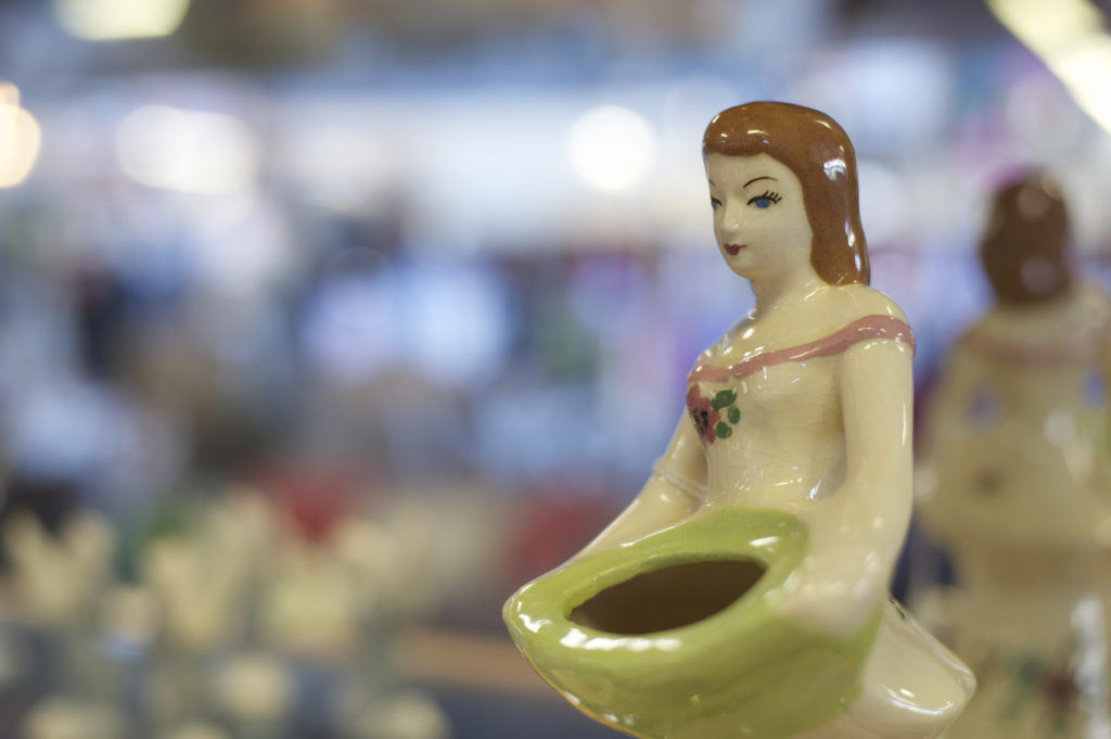 ceramic woman holding a basket