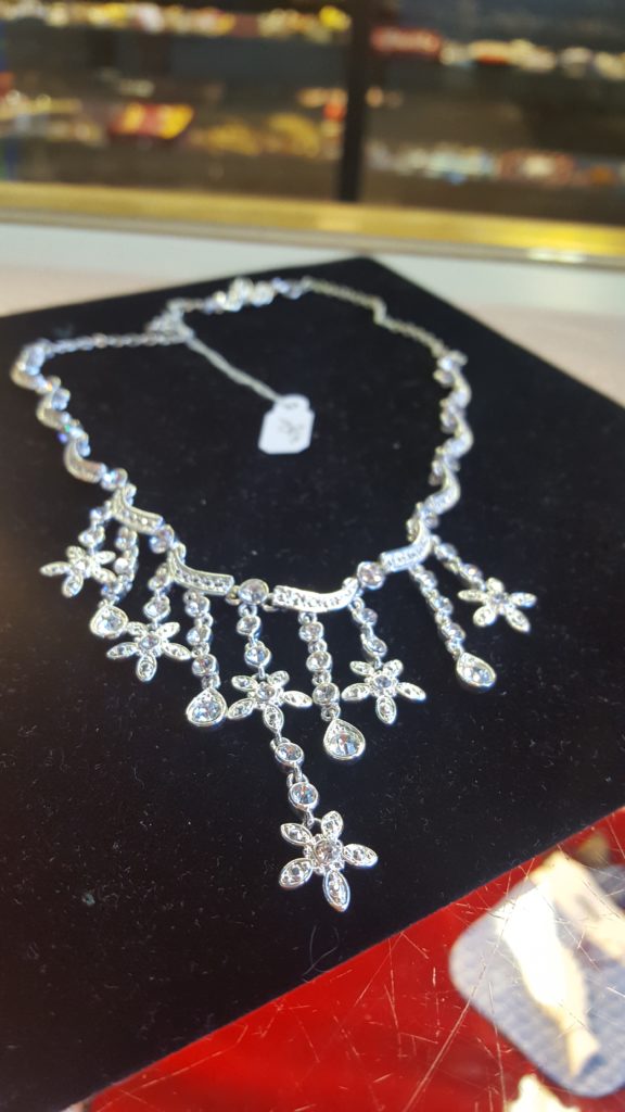 silver colored necklace