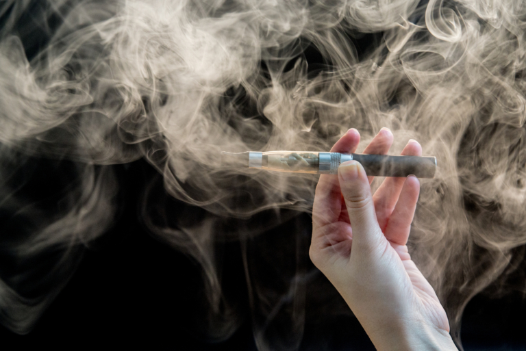 woman smoking electronic cigarette