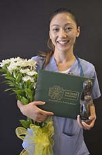 Sunshine Lor holding the Daisy award