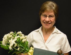 Mary Knight holding the Daisy award