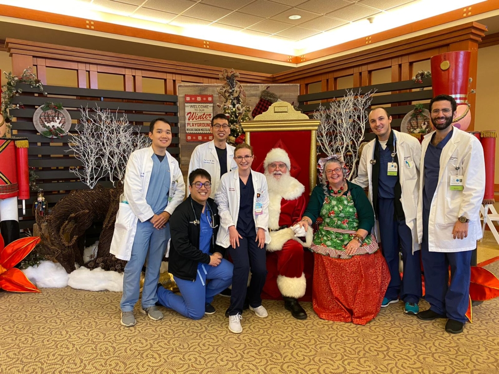 Santa Claus sitting with a group of residents