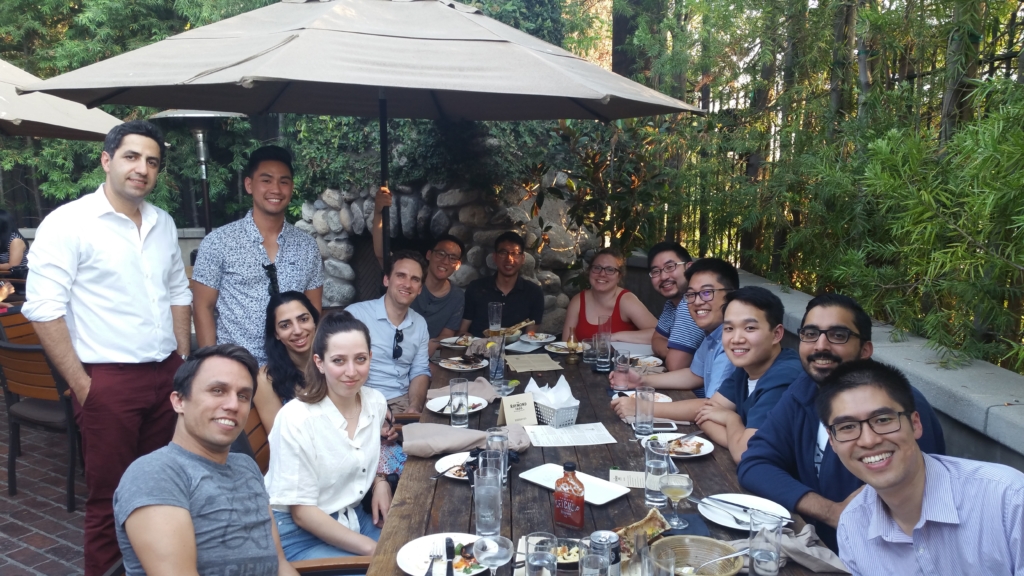 A group of residents eating together at a patio of a restaurant