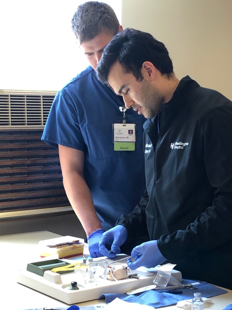 A doctor helping a resident