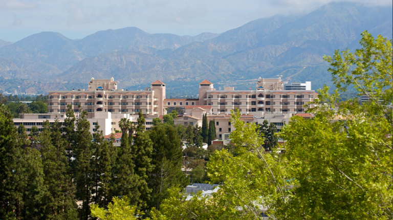 Aerial view of Huntington Hospital surrounded by trees and mountains
