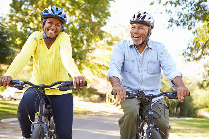 A couple riding bikes side by side