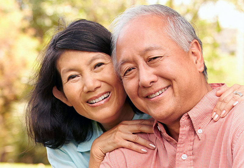 Happy senior asian couple smiling