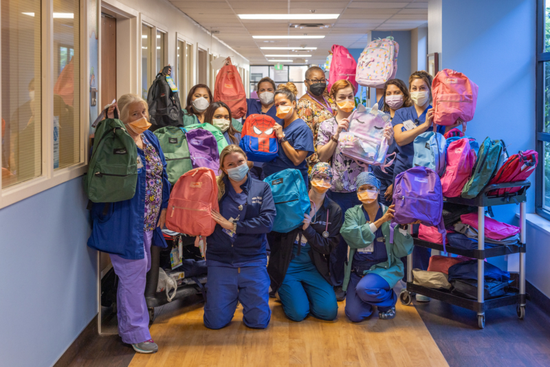 Huntington Health employees kick-off the school year with backpack donations to the community