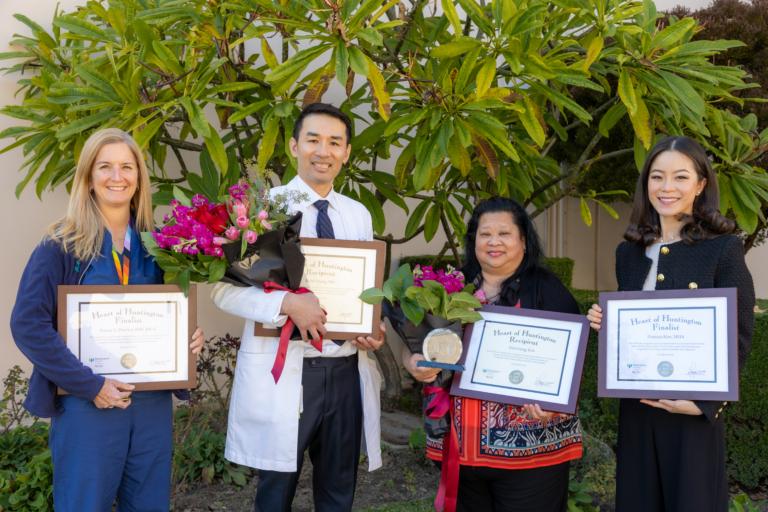 Heart of Huntington winners group picture with awards and flowers