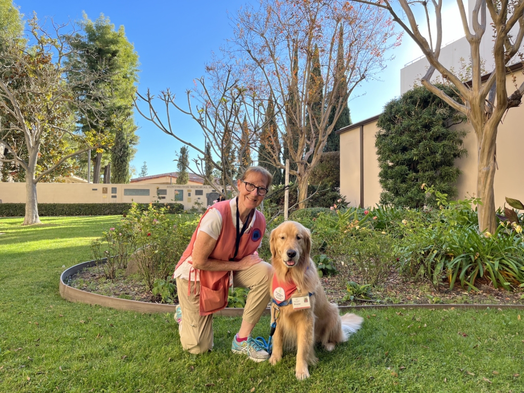 A pet assisted therapist walking the dog.
