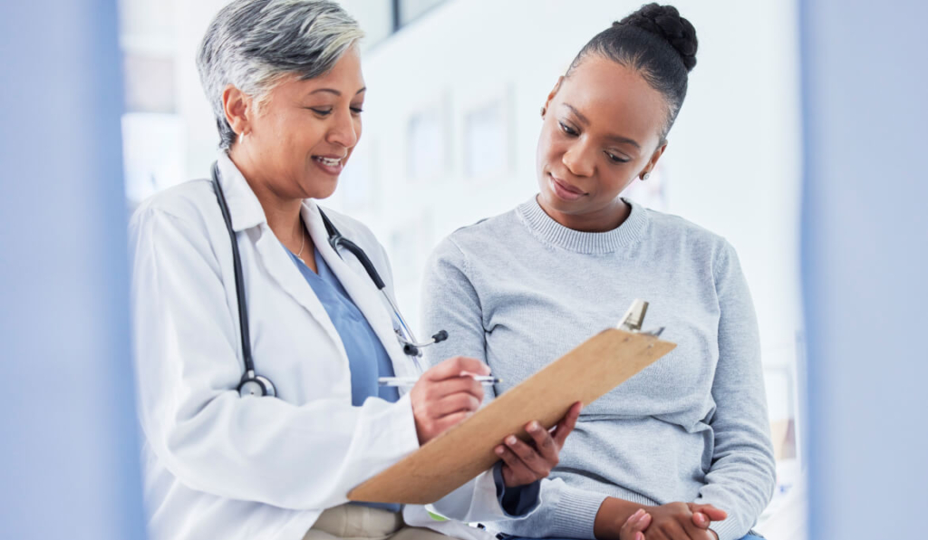 doctor with documents, talking to patient