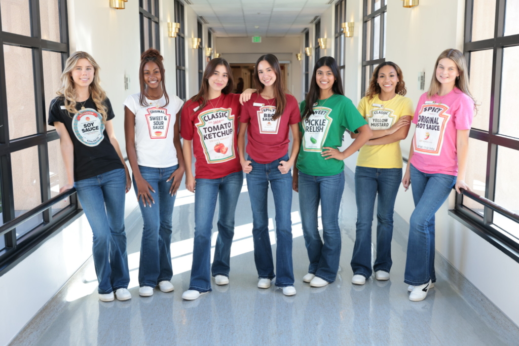 Hospital staff and volunteers in colorful condiment costume t-shirts