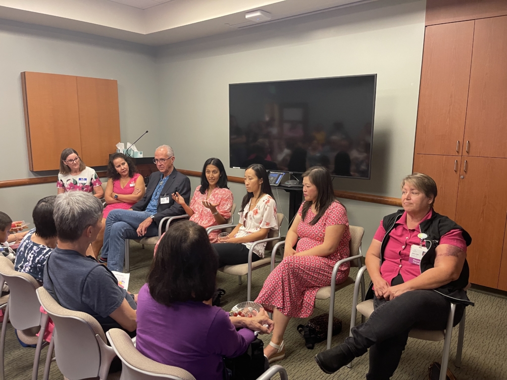 Members of the interactive panel discuss topics related to breast cancer with attendees.