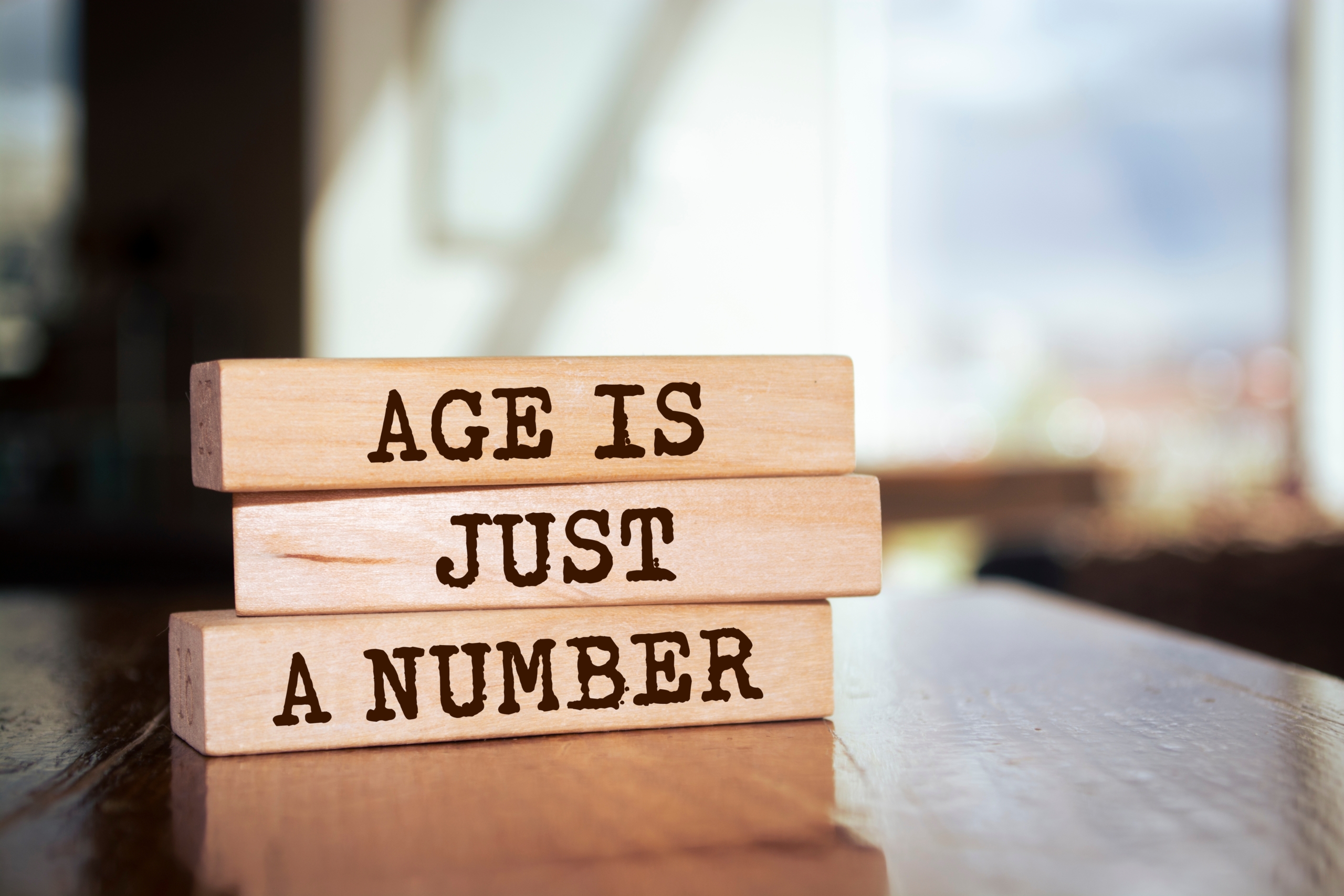 Wooden,Blocks,With,Words,'age,Is,Just,A,Number'.
