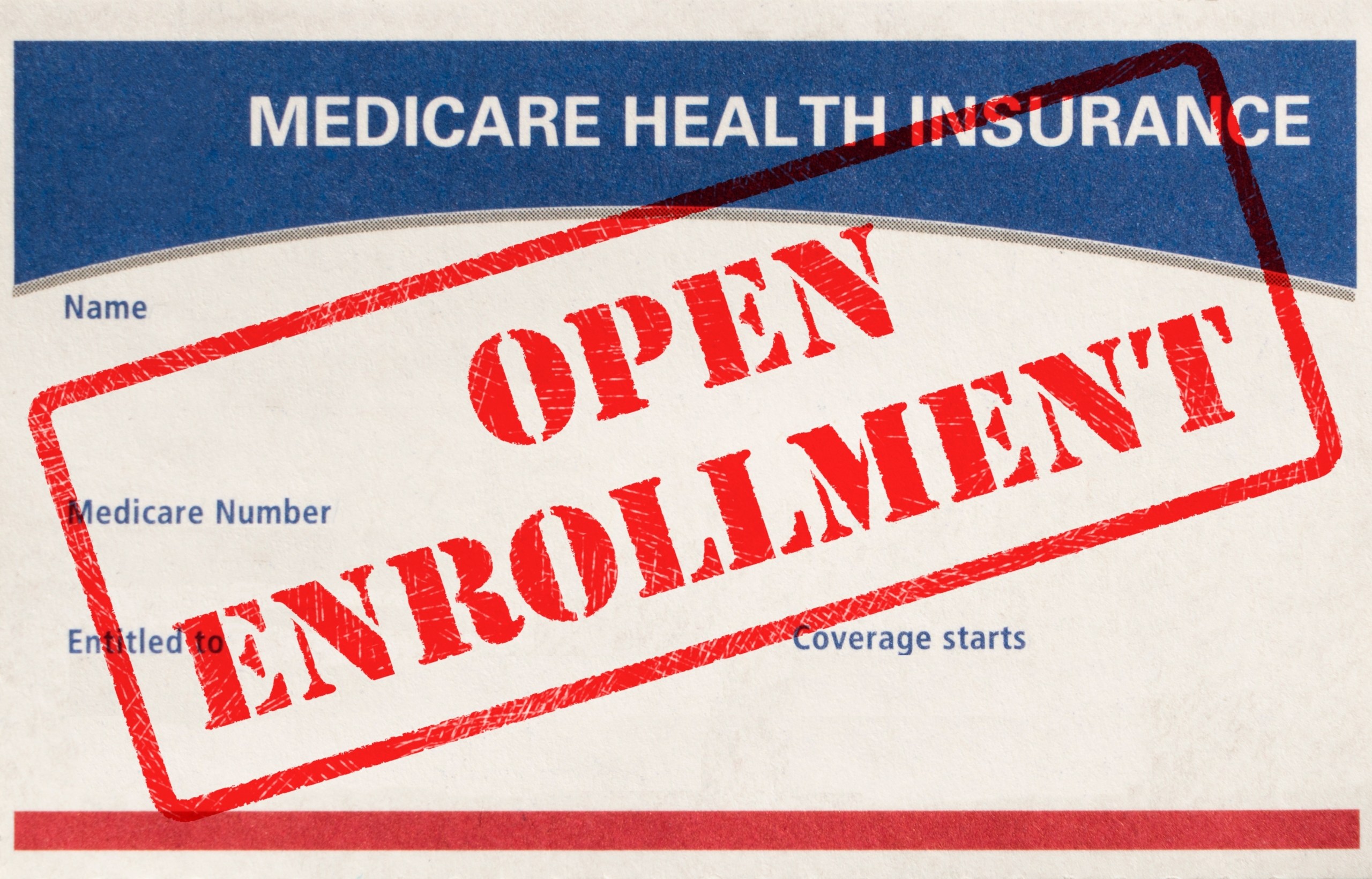 Open,Enrollment,Rubber,Stamp,On,A,Medicare,Card